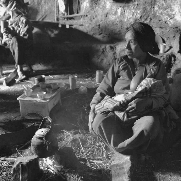 Mother and baby in thatched house in Simien Mountains